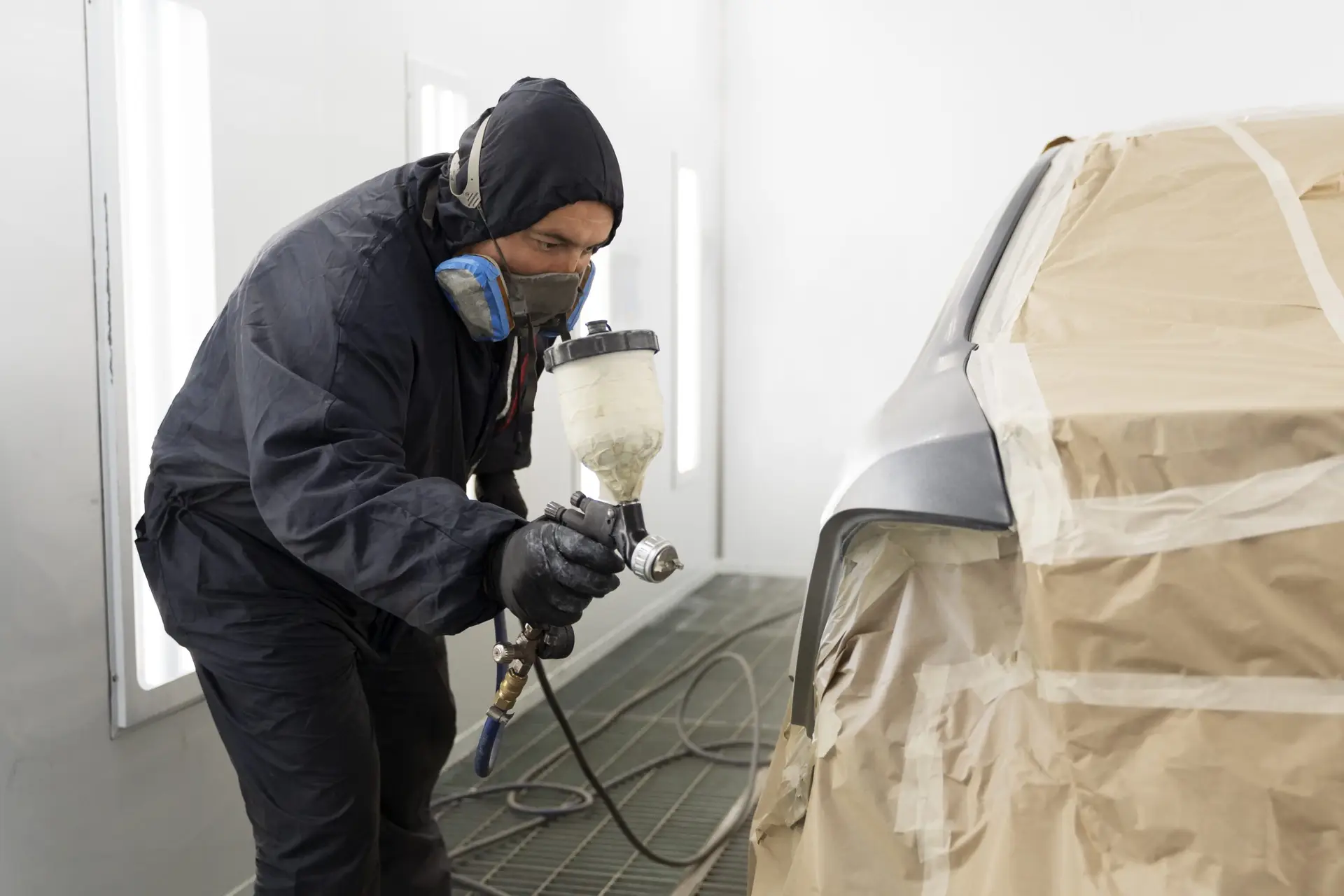 service worker painting car auto service